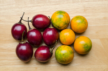 Tree tomatoes and lulos on a wooden background