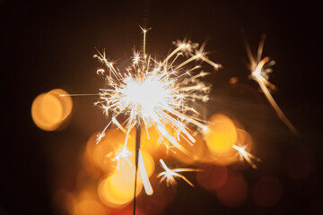 Sparkler shining in the darkness on a bonfire night