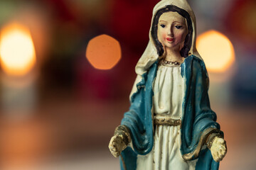 holy mary sculpture and flower