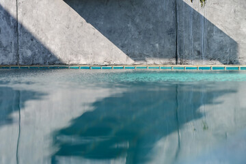 blue swimming pool and cement wall, construction industry