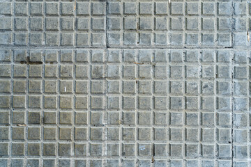 Obraz premium Background of square tiles or slabs on a wall.