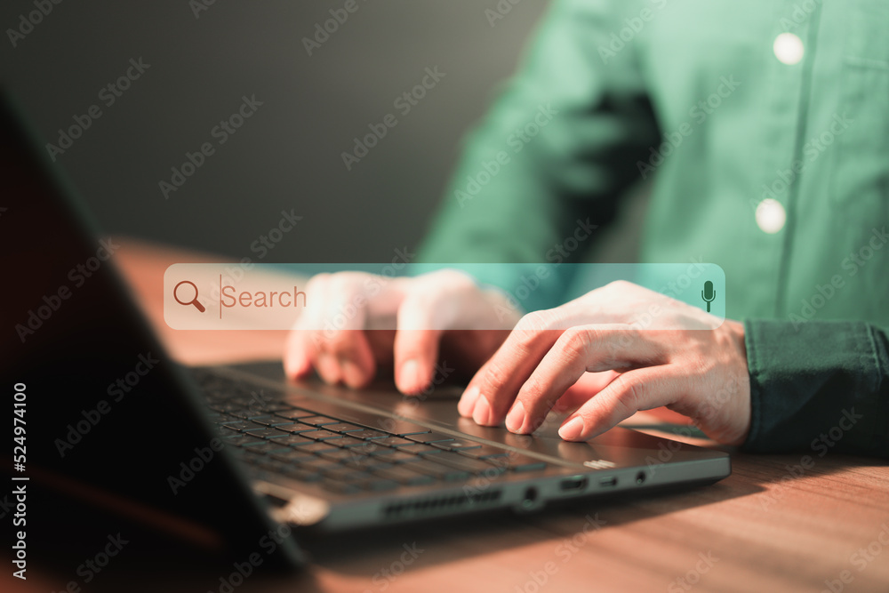 Poster Man using a laptop in the office for searching browsing internet data information. Business concept for Using search with your website.