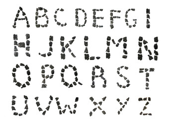 charcoal font. coal alphabet isolated on white background. Letters from pieces of coal . Black abs letters on a white background in a black charcoal frame.typography 