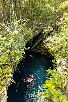 Cenote Pit top view, freediving session in the cenote of Mexico, Tulum, Mexico