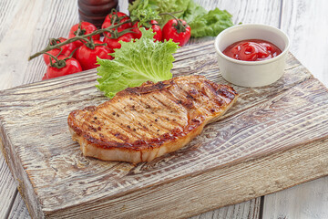Grilled pork steak with ketchup