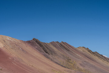 Amazing Mountainous Landscape In Peru.

photography of huaraz peru, with people with hiking clothes, lakes, mountains, colors, rainbow mountain.