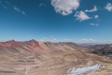 Amazing Mountainous Landscape In Peru.

photography of huaraz peru, with people with hiking clothes, lakes, mountains, colors, rainbow mountain.