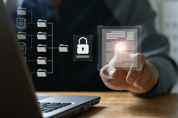 Business people use laptops to access information in online documents. through the protection system. Document Management System (DMS), online documentation database, digital file storage system.