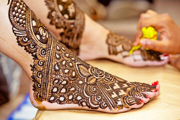 henna design on Bride's feet on her wedding eve.