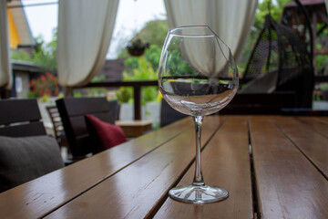 Brocken crystal glass without water. Stay hydrated concept. Concept of fluid balance or homeostasis. Importance of drinking water for health