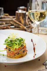 warm salad with greens and eggplant in a white plate
