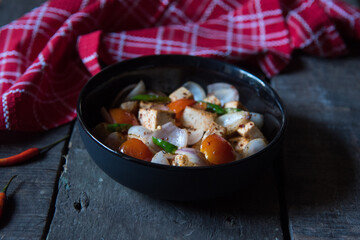Popular north Indian dish paneer or cottage cheese with veggies saute in a bowl. Close up,...