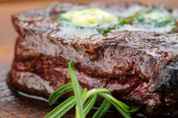 fried steak grilled meat on a board macro photo
