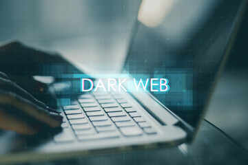 Close up of hands using laptop computer with creative digital text hologram on blurry background....
