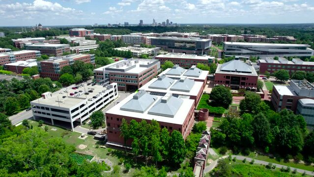 Drone shot of NC State University with the Raleigh skyline in the distance