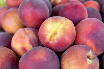 Fototapeta na wymiar New harvest peaches for sale at city farmers market