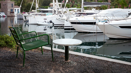 Fototapeta premium empty marble table in front of marina background, close up
