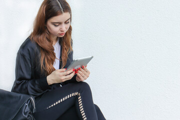 A beautiful student girl using a computer, laptop