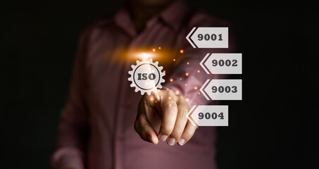 A businessman touch the ISO certificate icon, ISO 9000 system, arrow label computer graphic light, standard quality document control for organization and industry management products