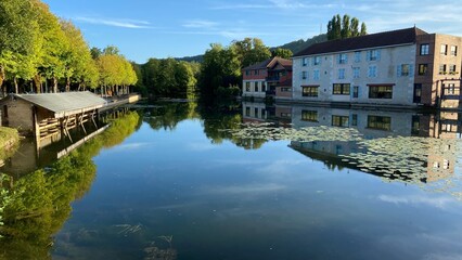 Fototapeta na wymiar Beautiful reflections of houses in Bar sur Aube in France on August 2022