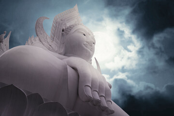 ิBig buddha Statue under the moonlight, Buddhism concept.