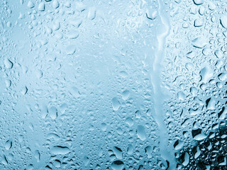 Water drops on glass background texture blue	