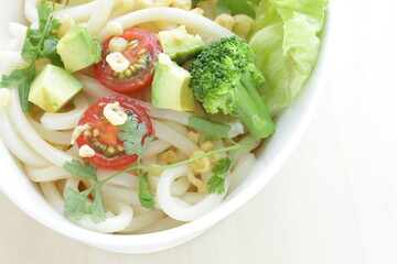 Japanese fusion food, broccoli and cherry tomato with avocado cold udon noodles for Summer cuisine 