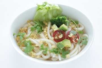Japanese fusion food, broccoli and cherry tomato with avocado cold udon noodles for Summer cuisine 