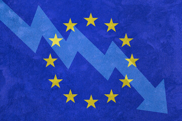 Arrow down on the background of the EU flag. The concept of economic recession, depression and...