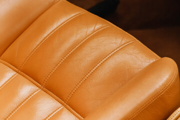 Upholstery of the seats in the car interior is leather with neat stitches.