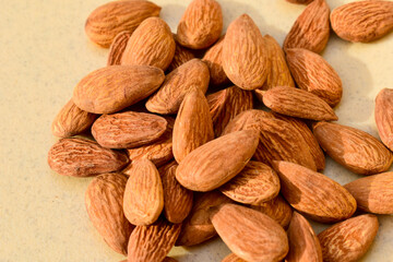 Almonds on wooden table background. Close up