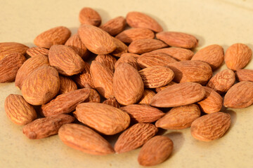Almonds on wooden table background. Close up