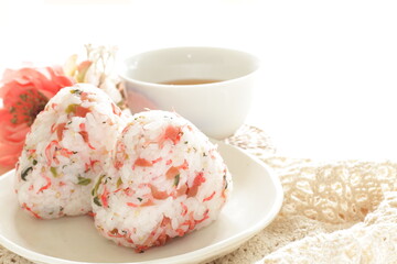 Japanese food, dried plum and small fishes mixed rice ball with barley tea