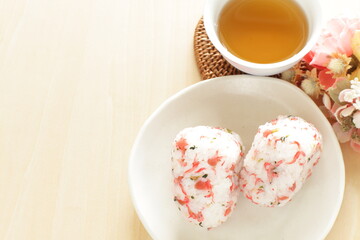 Japanese food, dried plum and small fishes mixed rice ball with barley tea