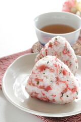 Japanese food, dried plum and small fishes mixed rice ball with barley tea