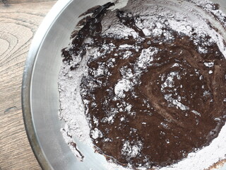 top view chocolate cake batter in mixing bowl