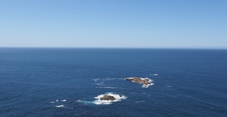Rocky islands in sea near A Coruna city in Galicia district of Spain