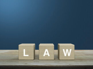 LAW letter on wood block cubes on wooden table over light blue wall, Frequently asked questions, Business customer service and support concept