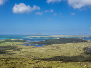 UK, Scotland, Clouds casting shadows over coastline of Outer Hebrides