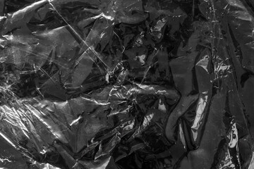 transparent plastic bag film wrap overlay texture on black background