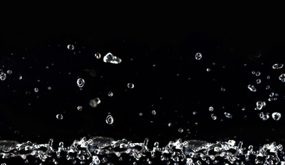horizontal image. Water splashes in the air. Water waves and airdrops, natural air water movement...