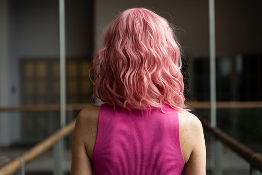 Young woman with pink dyed hair