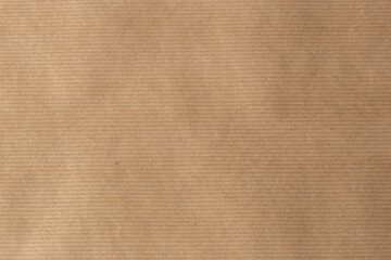Naklejka na ściany i meble Brown parcel packaging paper for wrapping parcels. Eco friendly recycling packaging.