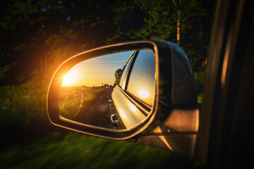 Road trip car mirror. Sun, highway car road reflection in mirror. Summer holidays trip concept.