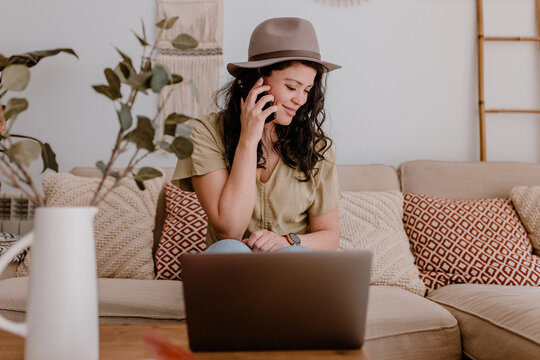 Hipster woman working at home with laptop