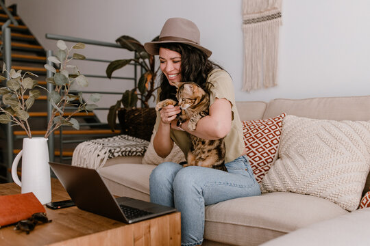 Hipster woman working at home with laptop