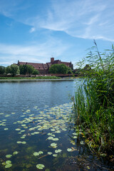 Obraz premium The largest brick castle in the world - Malbork Castle on the Nogat River, Poland