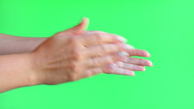 Female Hands are clapping on green screen background. Girl Hands applauding on a chroma key background. Applause on chromakey. Concept of victory and award.