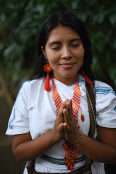 Young native Arhuaco woman in forest