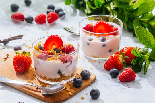 Strawberries and berries served with fresh yogurt